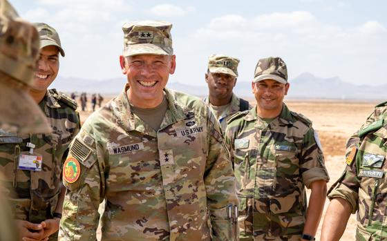 Army Maj. Gen. Todd Wasmund, commander of the Southern European Task Force, Africa, greets the leaders of airborne and medical units in Ben Guerir, Morocco, on June 10, 2023, during Exercise African Lion.