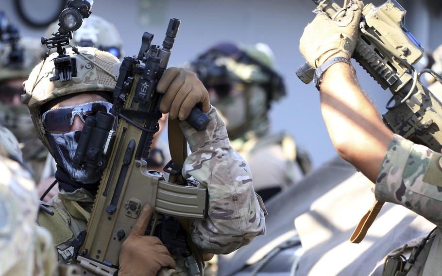 Special forces operators hold their weapons during a joint U.S.-Cyprus military drill at Limassol port on Friday, Sept. 10, 2021.