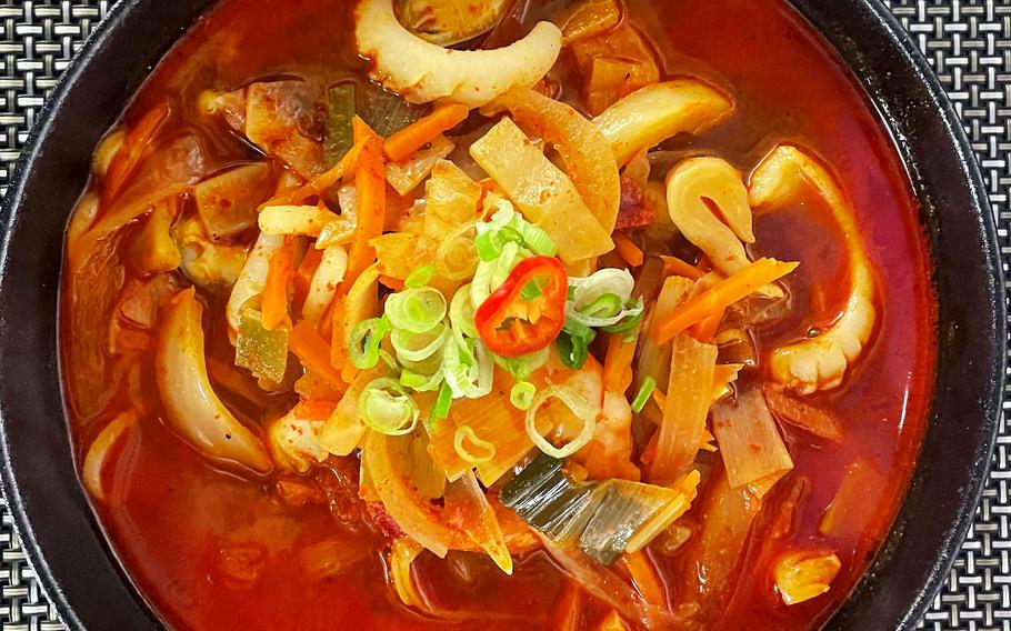 Gochugaru, a spicy noodle soup full of shrimp, mussels and squid, served at the Korean restaurant Ido in Sulzbach, Germany, March 13, 2022. The soup also had plenty of onions, peppers and cabbage. 