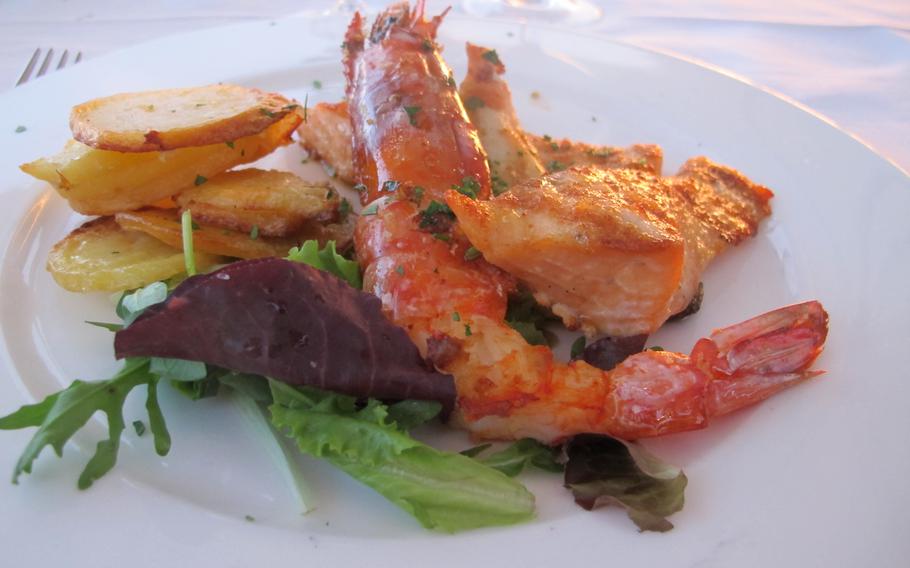 A second course of grilled fish and shellfish at Hotel Catullo in Sirmione, Italy, where diners can order a la carte or, if they're hotel guests, can choose the more economical and equally delicious set menu.  