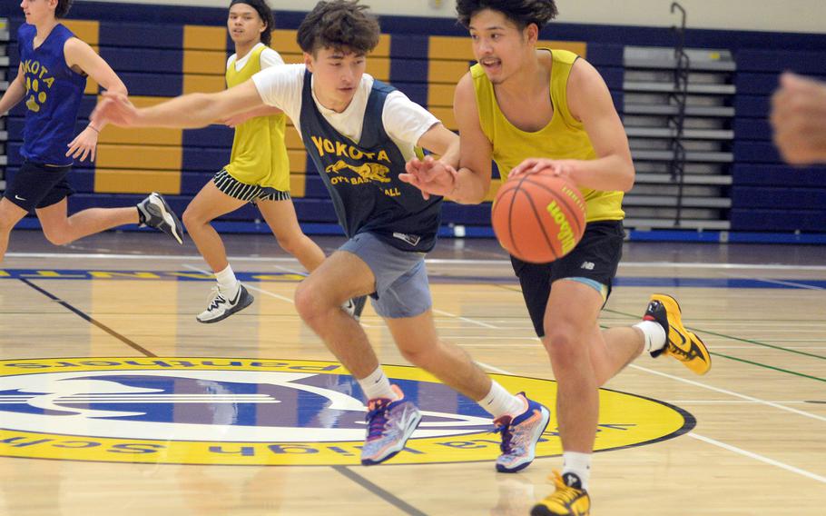 Senna Solberg and Dylan Tomas are two of nine seniors on Yokota's boys basketball team.