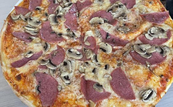 A salami pizza with mushrooms at L'Italiano restaurant in Weiden, Germany, Feb. 16, 2022.
