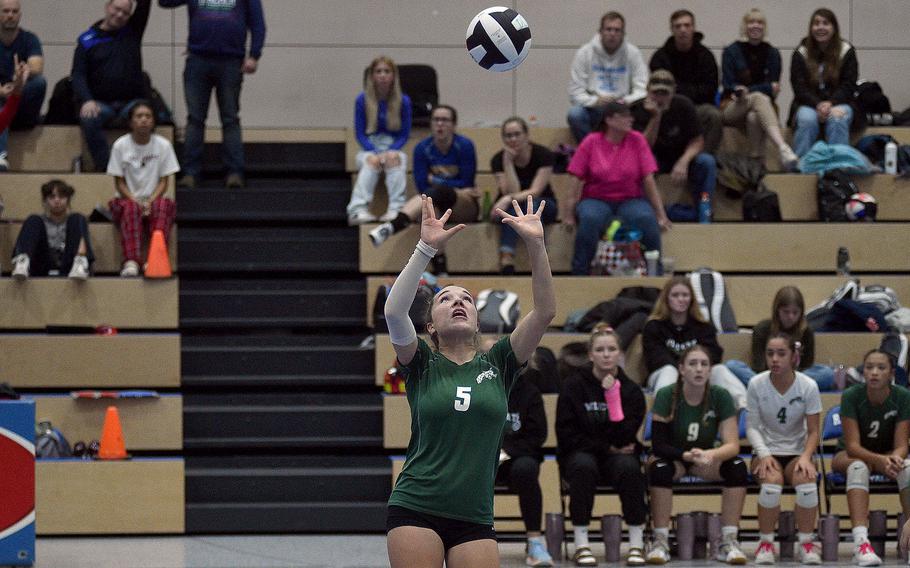 Naples' Emma Heavey sets the ball during a Division II semifinal match against Black Forest Academy at the DODEA European volleyball championships on Oct. 27, 2023, at Ramstein High School on Ramstein Air Base, Germany.