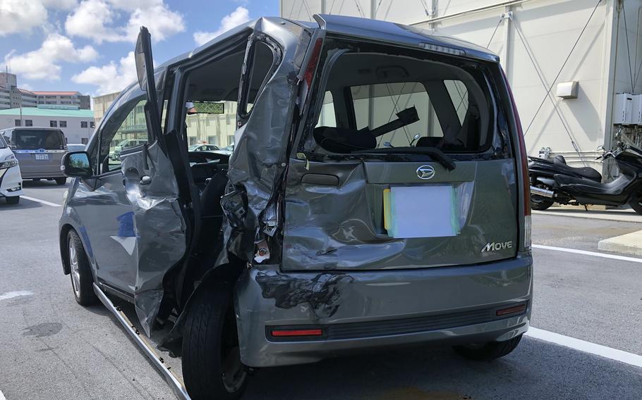 This gray Daihatsu Move, seen here at the police station in Ginowan, Okinawa, Tuesday, Sept. 19, 2023, was damaged in a hit-and-run crash with a vehicle believed to have ties to the U.S. military community.