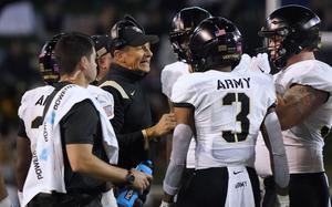FILE - Army head coach Jeff Monken talks to his his players during the first half of an NCAA college football game against Wake Forest in Winston-Salem, N.C., Saturday, Oct. 8, 2022. The American Athletic Conference has been in contact with Army as it looks for a replacement for Atlantic Coast Conference-bound SMU, according to two people with direct knowledge of the discussions. (AP Photo/Chuck Burton, File)