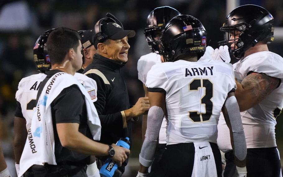 Army head coach Jeff Monken talks to his his players during the first half of an NCAA college football game against Wake Forest in Winston-Salem, N.C., Oct. 8, 2022. 