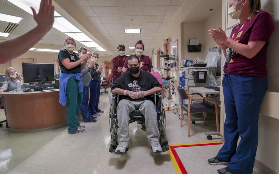 Nathan Foote is overcome with emotion while nurses cheer him on as he departs from M Health Fairview University of Minnesota Medical Center In Minneapolis on May 3, 2021. 