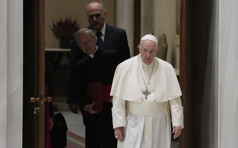 Pope Francis arrives for an audience with Lutheran pilgrims, in the Pope Paul VI hall at the Vatican, Monday, Oct. 25, 2021. (AP Photo/Andrew Medichini)