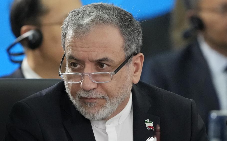 Iran’s Foreign Minister Abbas Araghchi sitting at BRICS.