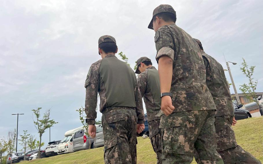 South Korean soldiers walk on the grounds of Camp Humphreys, South Korea, Friday, July 7, 2023.