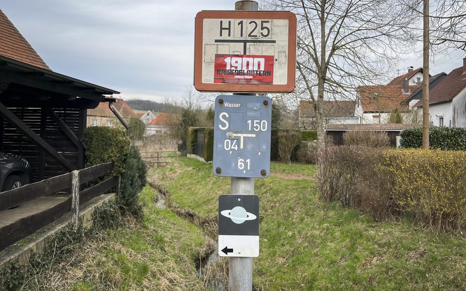 Signs depicting Saturn help hikers on the planet walk in Heiligenmoschel, Germany, find their way to the various stations, from Neptune to Mercury and then to a hilltop sundial.