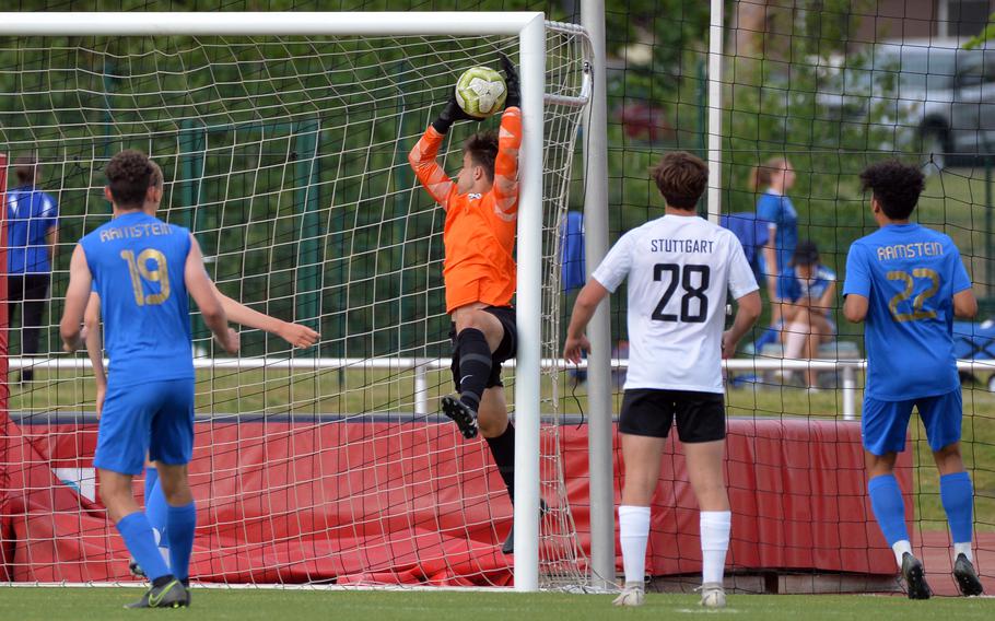 Stuttgart keeper Patryk Reeves first makes the save, but falls behind the goal line for Ramstein’s 1-0 in the boys Division I final at the DODEA-Europe soccer championships in Kaiserslautern, Germany, Thursday, May 19 2022. 