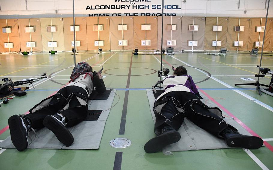 Kaiserslautern teammates Ann Mcray, left, and Katelynn McEntee take practice shots before starting the prone part of the competition Saturday, Dec. 10, 2022, at RAF Lakenheath, England. Shooters are given a warmup phase of 5 minutes prior to attempting shots for the record.