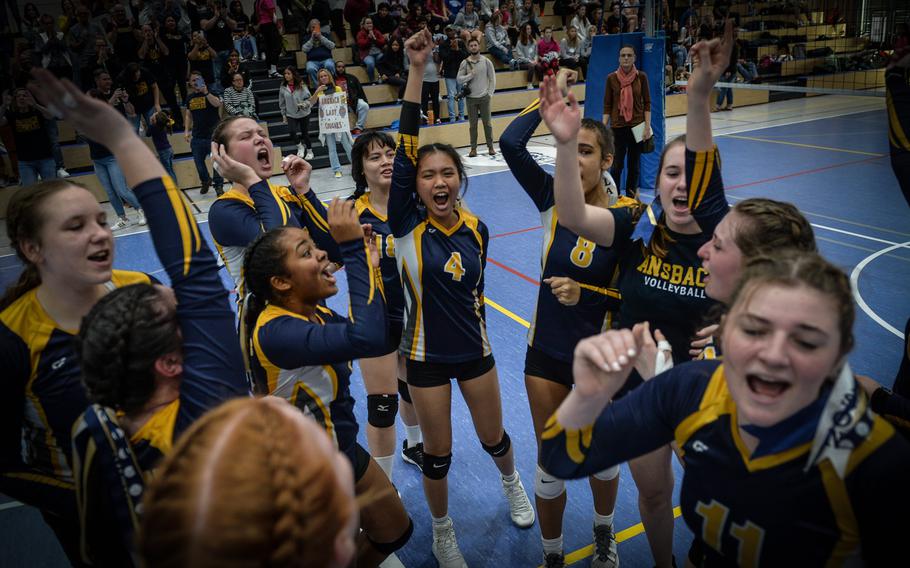 The Ansbach Cougars celebrate their win of the 2022 DODEA-Europe Division III Volleyball Tournament Oct. 29, 2022, at Ramstein Air Base, Germany. The team bested Sigonella 25-23, 25-19, 25-21.