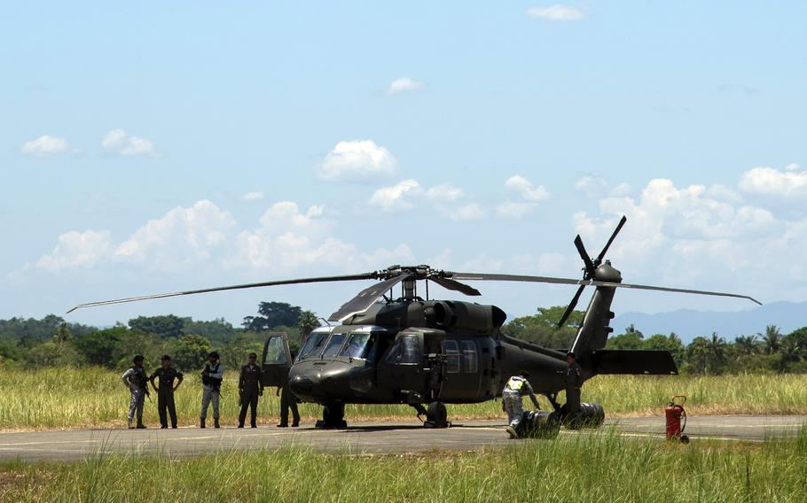 A Philippine army UH-60 Black Hawk parks at Lal-lo Airport, also known as Cagayan North International Airport, during Balikatan training in the Phillipines on May 4, 2024.