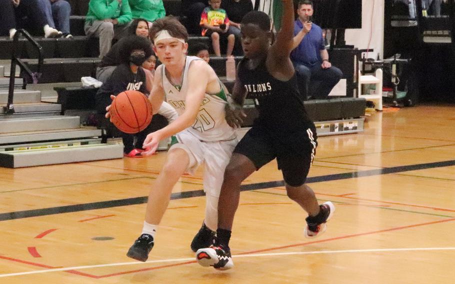 Kubasaki's Luka Lantz looks to drive against Zion Christian's Edwin Nguona.