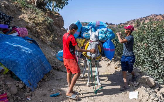 Villagers load their belongings on a donkey in an earthquake-devastated Tizi n'Test, near Taroudant on Sept. 15, 2023. The magnitude 6.8 earthquake - Morocco's strongest ever - has killed nearly 3,000 people and injured more than 5,600 since it hit on September 8 in Al-Haouz province, south of tourist hub Marrakesh. 