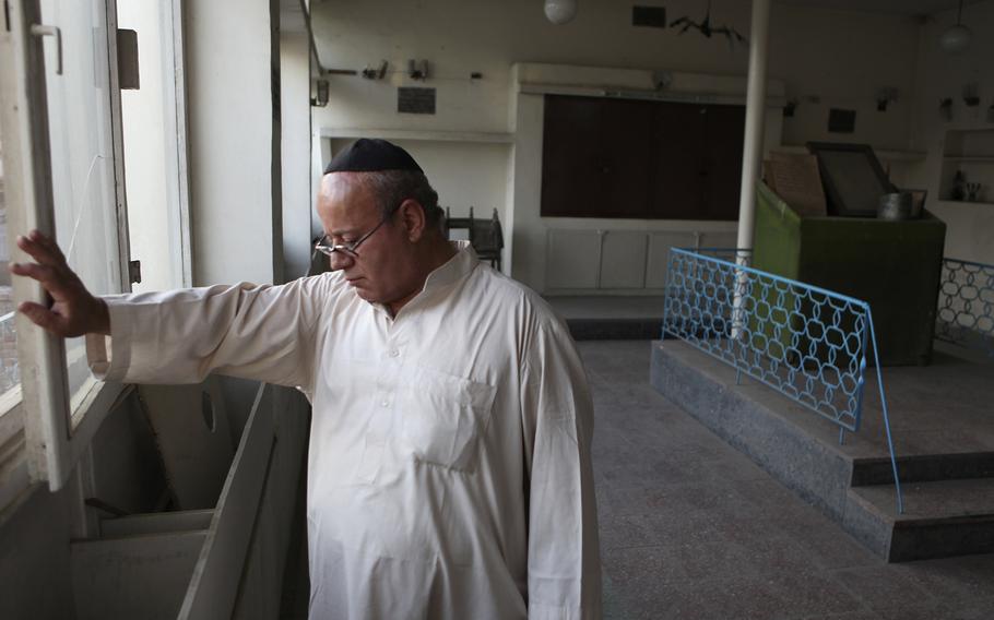 Zebulon Simentov, the last known Jew living in Afghanistan, closes the window to the synagogue he cares for in his Kabul home on Aug. 29, 2009.