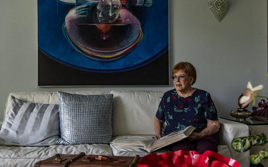 Evelyn Walg Grunberg poses in her apartment in Aventura. This summer she will gather in France with other family members to commemorate their family’s escape from Nazi-occupied Europe in 1942.