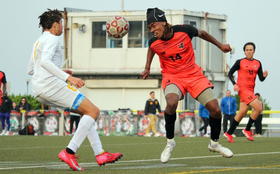 Mykhi Russel and Cecil Jackson battle for the ball.