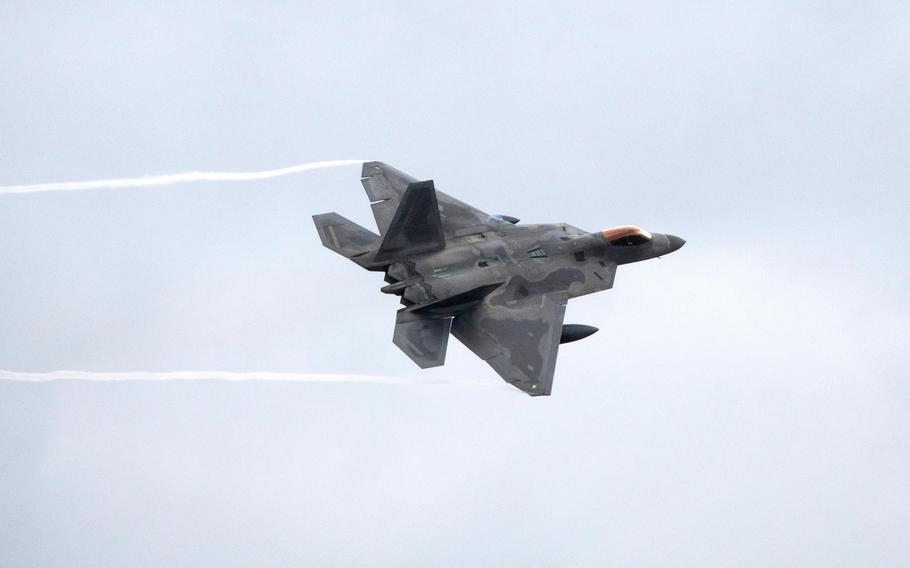 An Air Force F-22 Raptor assigned to the 3rd Wing trains above Joint Base Elmendorf-Richardson, Alaska, July 19, 2022. Six Raptors from the wing's 90th Fighter Squadron arrived at RAF Lakenheath, England, on July 26, on their way to Poland as part of NATO operations.