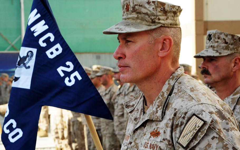 Cmdr. Jeromy Pittmann, seen here as a lieutenant commander in Afghanistan in 2014, is facing charges he took bribes to falsify documents for Afghans who aided U.S. forces and sought U.S. visas. 