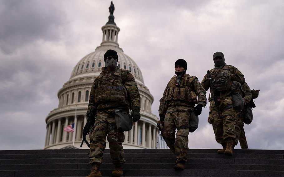 National Guard Troops from Virginia walk down the stairs toward the Capitol Visitors Center on Jan. 18, 2021 in Washington, DC. 