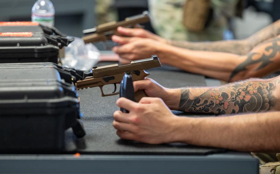 Students work with pistols.