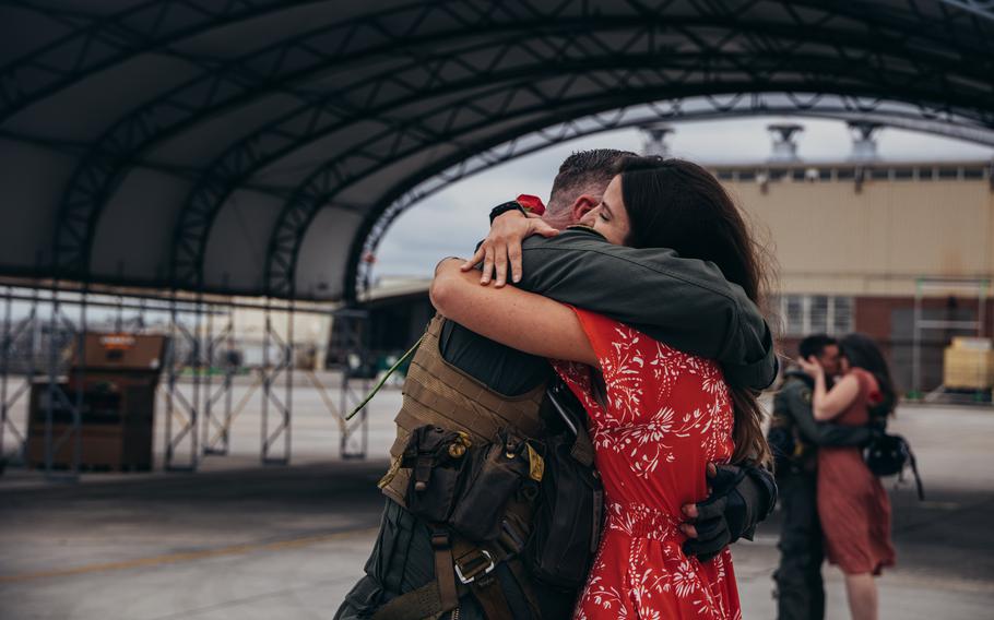 A U.S. Marine AV-8B Harrier pilot assigned to Marine Attack Squadron 231 Detachment, Marine Medium Tiltrotor Squadron 162 (Reinforced), 26th Marine Expeditionary Unit (Special Operations Capable) is reunited with his wife after returning from deployment at Marine Corps Air Station Cherry Point, N.C., Saturday, March 16, 2024.