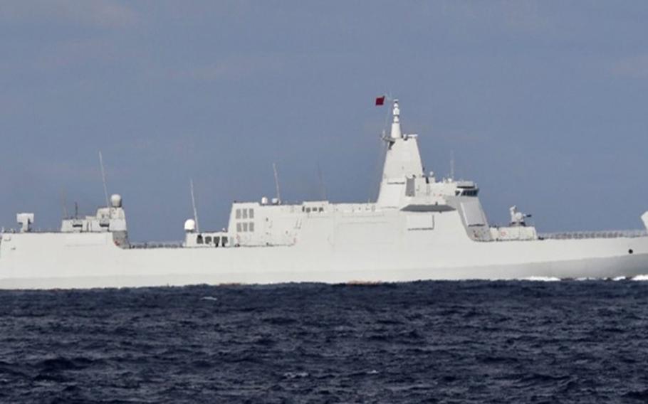 A Chinese navy guided-missile destroyer sails through the Tsugaru Strait between Japan’s Honshu and Hokkaido islands, Monday, Oct. 18, 2021. 