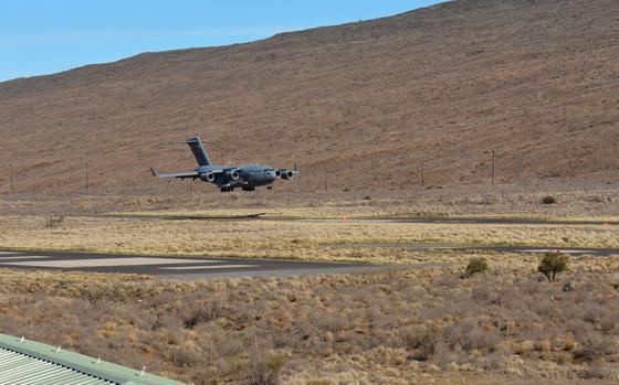 An Air Force C-17 Globemaster arrives at Pohakuloa Training Area, Hawaii, Sept. 22, 2022, during a test landing in preparation for the Army’s upcoming Joint Pacific Multinational Readiness Center exercise.