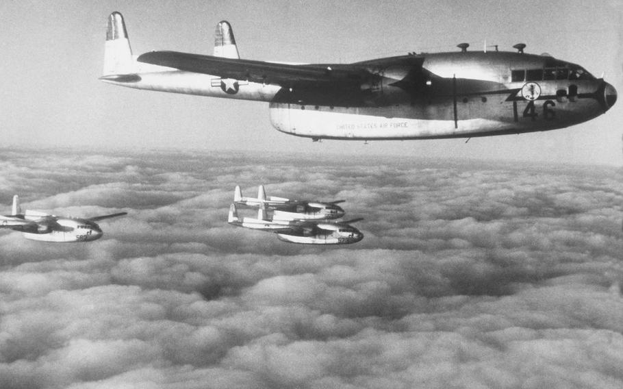 A formation of U.S. Air Force Fairchild C-119 transport planes, known as Flying Boxcars, fly over Korea in 1952.