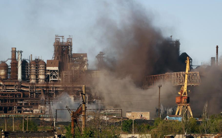 Smoke rises from the Metallurgical Combine Azovstal in Mariupol during shelling, in Mariupol, in territory under the government of the Donetsk People's Republic, eastern Ukraine, Saturday, May 7, 2022. 