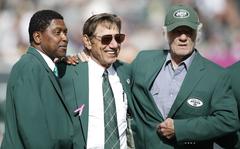 FILE - Former New York Jets wide receiver Wesley Walker, left, Hall of Fame quarterback Joe Namath, center, and Hall of Fame wide receiver Don Maynard, right, participate in a New York Jets Ring of Honor ceremony honoring former Jets defensive tackle Marty Lyons during a halftime ceremony of an NFL football game between the New York Jets and the Pittsburgh Steelers Sunday, Oct. 13, 2013, in East Rutherford, N.J. Don Maynard, a Hall of Fame receiver who made his biggest impact catching passes from Joe Namath in the wide-open AFL, has died. He was 86. The Pro Football Hall of Fame confirmed Maynard's death on Monday, Jan. 10, 2022, through his family. (AP Photo/Kathy Willens, File)