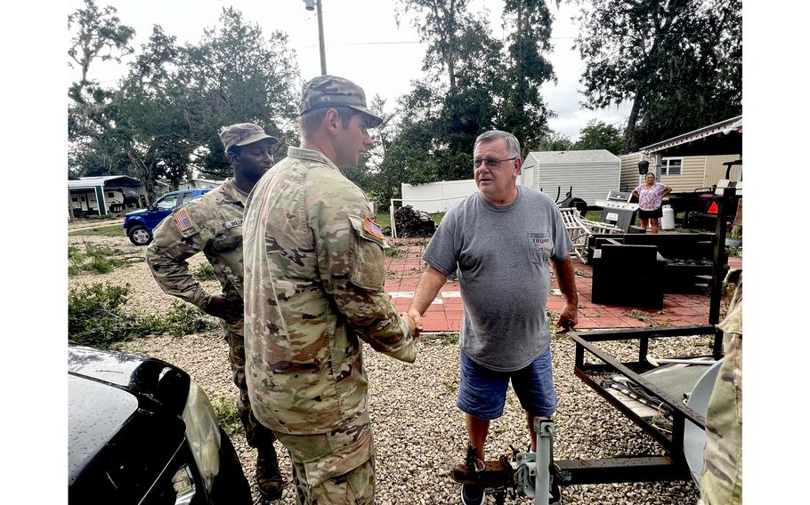 Florida National Guard soldiers clear debris in Steinhatchee, Fla., on Wednesday, Aug. 30, 2023, after Hurricane Idalia swept the state. 