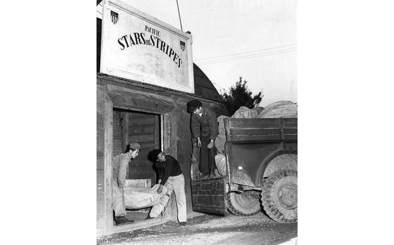 Seoul, South Korea, sometime in 1956: Workers load bundles of the Korean edition of Pacific Stars and Stripes on a truck for delivery at the paper's print and distribution point in Seoul, South Korea.  After nearly six years of printing the Korean edition of Pacific Stars and Stripes, the Korea Printing Plant had stopped its presses. Taking over was a new, fast, multi-color press in Tokyo which would print a 24-page edition for the troops on the Korean peninsula.  The exact date of photograph is unknown. 