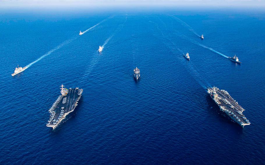 The aircraft carriers Gerald R. Ford, left, and Dwight D. Eisenhower sail in formation with ships from their carrier groups, along with U.S. 6th Fleet command ship USS Mount Whitney, and Italian navy frigates Carlo Margottini and Virginio Fasan in the Mediterranean Sea, Nov. 3, 2023. 