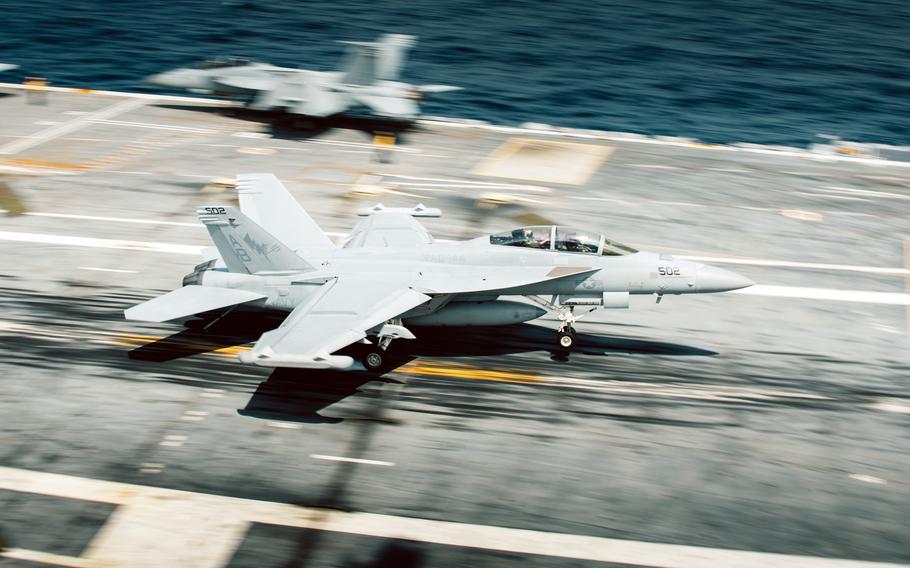 An EA-18G Growler lands aboard the aircraft carrier USS George Washington while underway in the Atlantic Ocean, June 26, 2023.