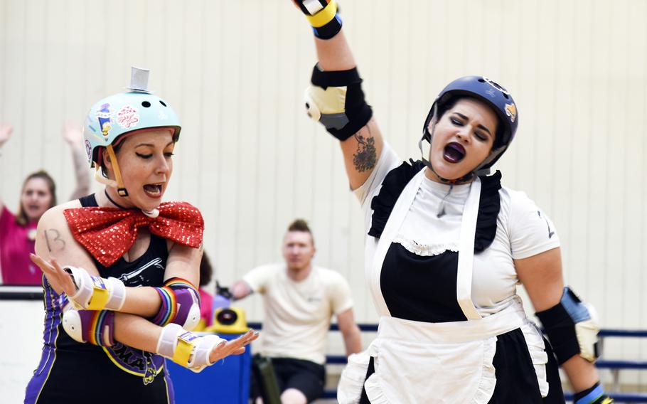 Alex Miller, left and  Jay Hudson, both of the Zama Killer Katanas, do “The Time Warp”  during a “Rocky Horror”-themed roller derby competition at the Samurai Fitness Center on Yokota Air Base, Japan, Sept. 24, 2023. 