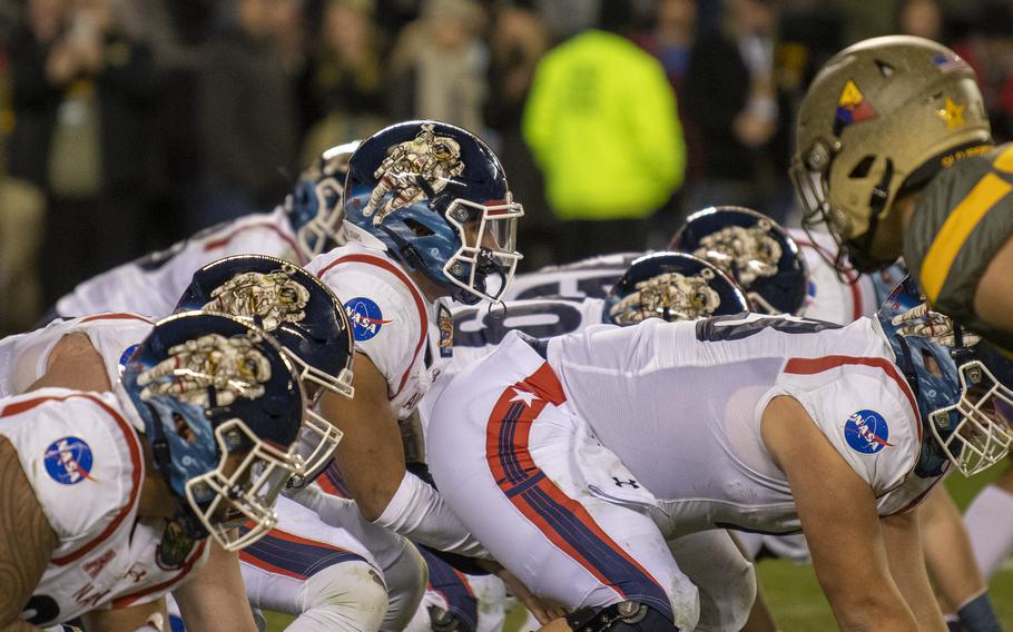 Navy’s offensive line is set for the snap as Army’s defensive linemen prepare to pounce during the 123rd Army-Navy football game played at at Philadelphia’s Lincoln Financial Field on Dec. 10, 2022. Army went on to beat Navy 20-17 in double overtime. Winning back the Commander-in-Chief’s Trophy is a prime goal for new Navy coach Brian Newberry.