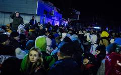 Ukrainians fleeing the Russian invasion wait at the Medyka crossing, at the border with Poland, in Shehyni, Ukraine, on Feb. 25, 2022. 