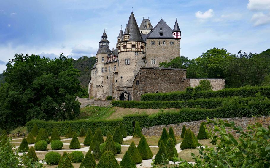 Buerresheim Castle stands high on a rocky outcrop near Mayen, Germany. The kitchen garden, shown in the foreground, is not open to the public. 