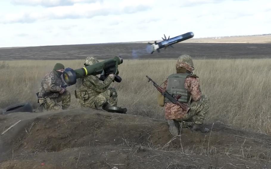 A video screen grab showsUkrainian soldiers using a launcher with U.S. Javelin missiles in the Donetsk region of Ukraine, on Jan. 12, 2022. 