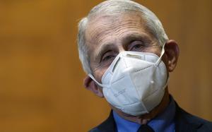 Dr. Anthony Fauci, Director of the National Institute of Allergy and Infectious Diseases, is seen before the start of a House Committee on Appropriations subcommittee on Labor, Health and Human Services, Education, and Related Agencies hearing, about the budget request for the National Institutes of Health, Tuesday, May 17, 2022, on Capitol Hill in Washington. (AP Photo/Mariam Zuhaib)