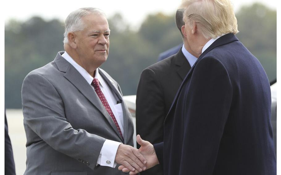 Speaker of the Georgia House of Representatives David Ralston greets President Donald Trump as he arrives at Dobbins Air Force Base on Friday, Nov. 8, 2019, in Marietta, Georgia. 