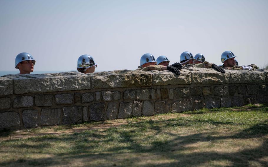 Members of the 529th Military Police Company (Honor Guard) wait to participate in a ceremony to mark the 80th anniversary of D-Day at the Normandy American Cemetery, Thursday, June 6, 2024.