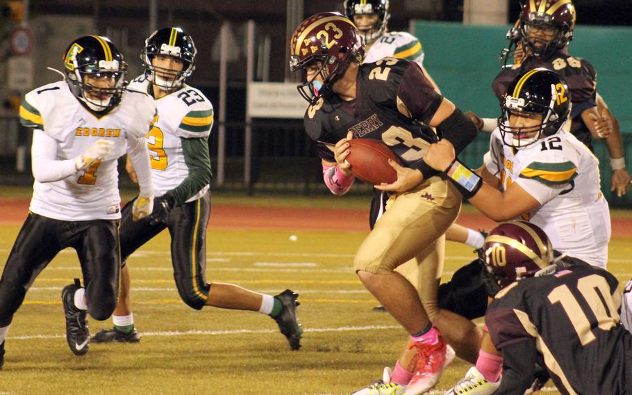 Matthew C. Perry's Maddix Larue tries to shake the tackle of Robert D. Edgren's Jayse Ulechong.