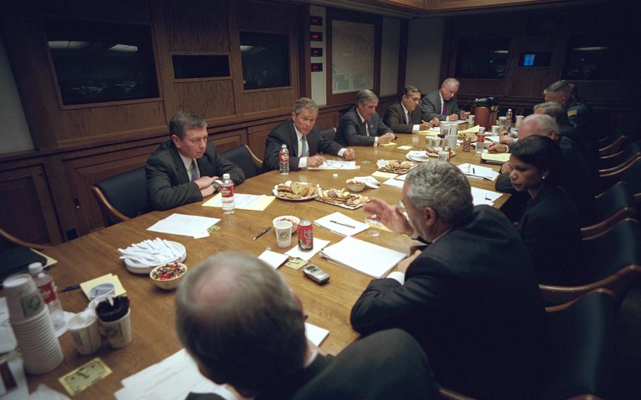 After addressing the nation Tuesday, Sept. 11, 2001, President George W. Bush meets with his National Security Council in the Presidential Emergency Operations Center of the White House.  