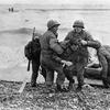 Omaha Beach, Normandy, France, June 6, 1944: Medics from the U.S. 5th and 6th Engineer Special Brigade (ESB) help wounded soldiers on Omaha beach, Fox Green and Easy Red sectors. Survivors of sunken landing craft who reached the beach by using a life raft are recovered by other troops.

Read the story of one of the many heroic medics, Bob Molinari, from Los Angeles, Calif, as written by Stars and Stripes reporter Bud Hutton, first published in Stars and Stripes' London edition, June 12, 1944 here.

META TAGS: DDAY80; WWII; World War II; D-Day; Operation Overlord; Battle of Normandy; military medical; beach; wounded; servicemember; WIA; casualty
