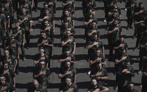 Hezbollah supporters beat their chests as they march during Ashoura, the Shiite Muslim commemoration marking the 7th-century death of Imam Hussein, the grandson of the Prophet Muhammad, at the Battle of Karbala, in the southern suburbs of Beirut, Lebanon, Sunday, July 6, 2025. (AP Photo/Hassan Ammar)